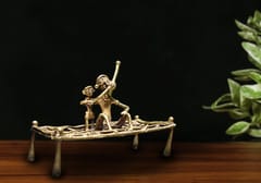 Brass Dhokra Showpiece - Man enjoying Hukkah on a Charpai (13 inches)